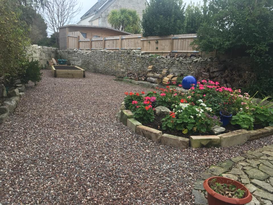 stone garden with areas filled with flowers